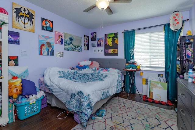 11435 Aries Dr, Orlando, FL 32837 - bedroom with wood finished floors, a textured ceiling, and ceiling fan