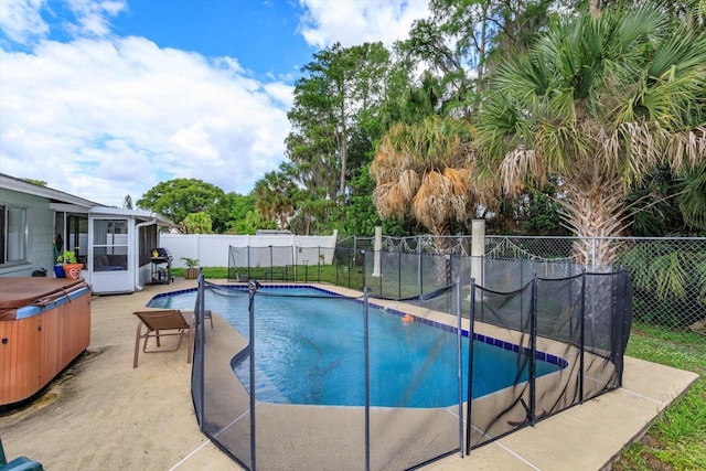 11435 Aries Dr, Orlando, FL 32837 - view of pool with a hot tub, a fenced backyard, a patio area, and a sunroom