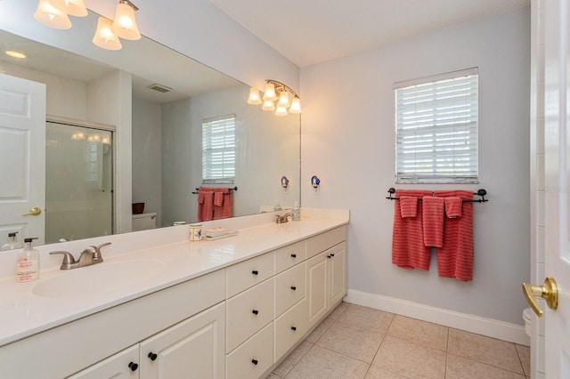 334 N Shadowbay Blvd, Longwood, FL 32779 - full bathroom with double vanity, a stall shower, and tile patterned flooring