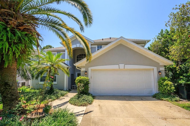 334 N Shadowbay Blvd, Longwood, FL 32779 - mediterranean / spanish home with stucco siding, driveway, and a garage