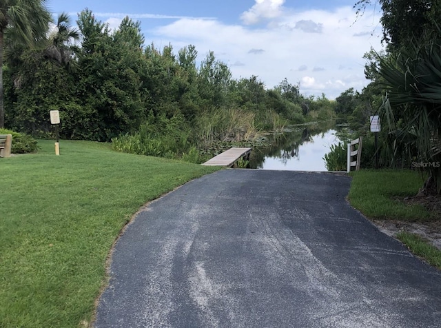 334 N Shadowbay Blvd, Longwood, FL 32779 - view of asphalt road with a boat ramp and a water view
