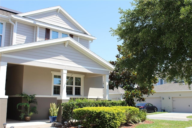 5897 Soter Ln, Windermere, FL 34786 - view of front of house featuring a garage and stucco siding