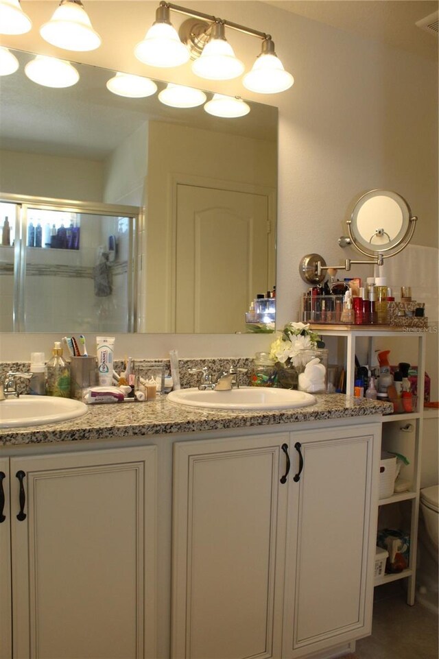 5897 Soter Ln, Windermere, FL 34786 - full bath with a shower stall, double vanity, and toilet