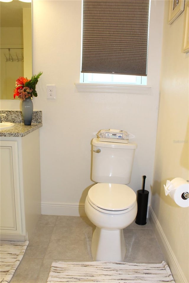 5897 Soter Ln, Windermere, FL 34786 - bathroom featuring vanity, toilet, baseboards, and tile patterned flooring