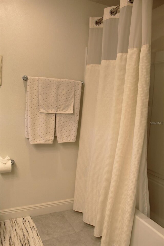 5897 Soter Ln, Windermere, FL 34786 - full bath featuring baseboards and shower / bath combination with curtain