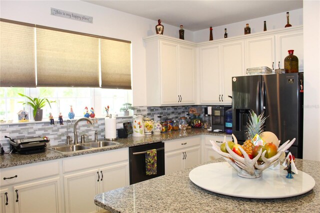 5897 Soter Ln, Windermere, FL 34786 - kitchen with stainless steel refrigerator with ice dispenser, dishwasher, tasteful backsplash, white cabinets, and a sink