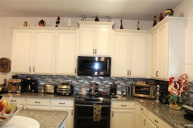 5897 Soter Ln, Windermere, FL 34786 - kitchen with double oven range, decorative backsplash, and light stone countertops