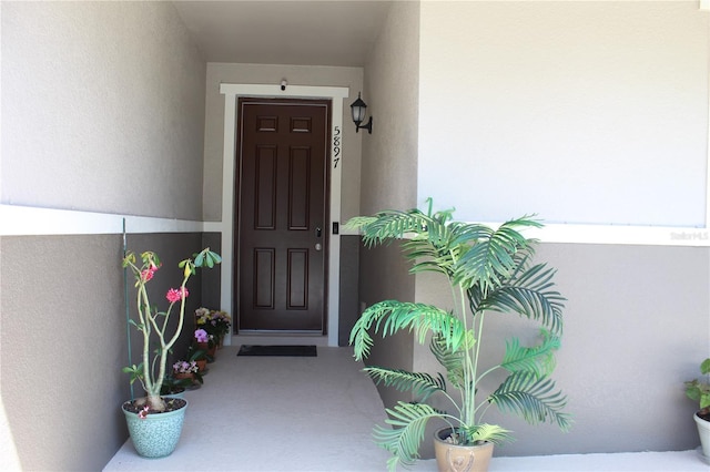 5897 Soter Ln, Windermere, FL 34786 - doorway to property featuring stucco siding