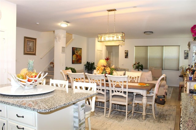 5897 Soter Ln, Windermere, FL 34786 - dining space with stairs and light wood-style flooring