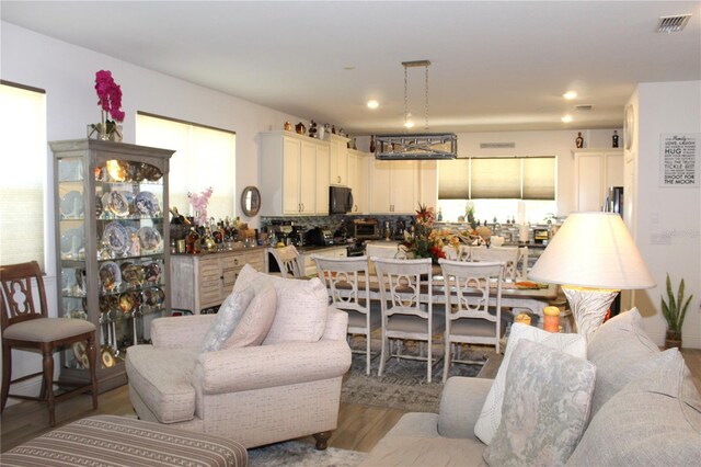 5897 Soter Ln, Windermere, FL 34786 - living room with wood finished floors, recessed lighting, and a chandelier