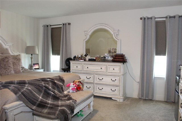 5897 Soter Ln, Windermere, FL 34786 - bedroom featuring light colored carpet and baseboards