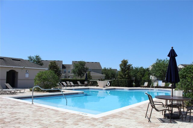 5897 Soter Ln, Windermere, FL 34786 - community pool with a patio and fence