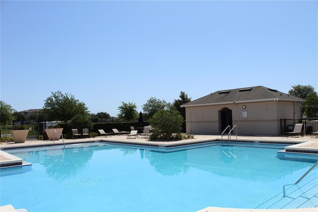 5897 Soter Ln, Windermere, FL 34786 - community pool with fence and a patio area