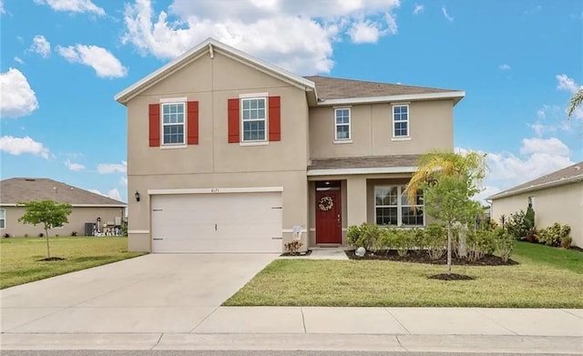 8171 Gopher Tortoise Trl, Lehigh Acres, FL 33974 - traditional-style home with stucco siding, driveway, an attached garage, and a front lawn