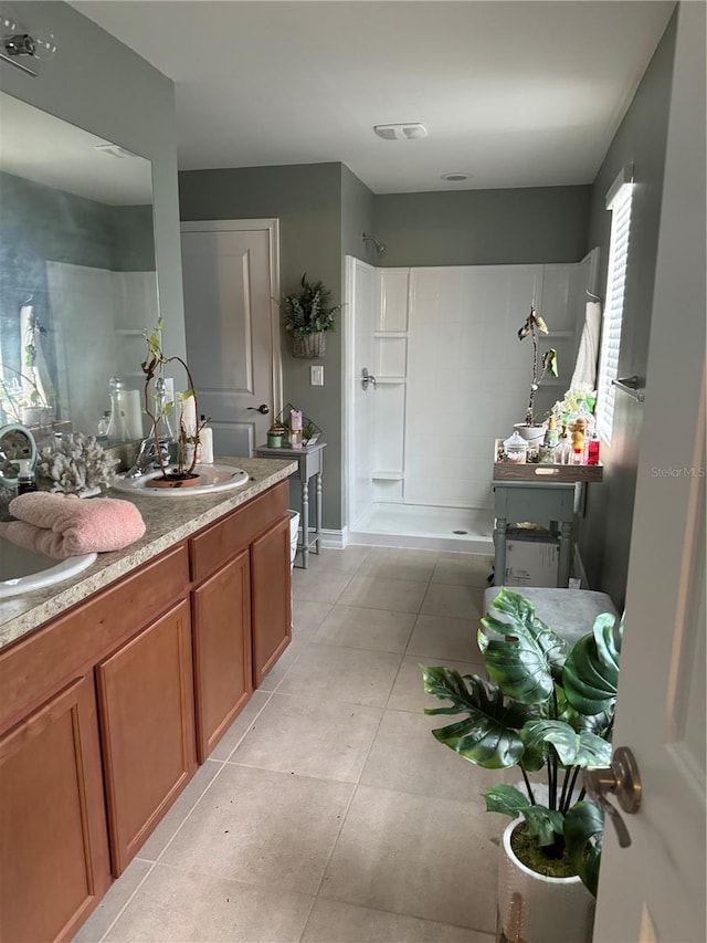 8171 Gopher Tortoise Trl, Lehigh Acres, FL 33974 - bathroom featuring a stall shower, vanity, and tile patterned flooring