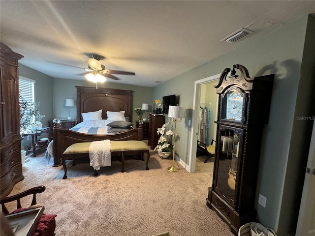8171 Gopher Tortoise Trl, Lehigh Acres, FL 33974 - bedroom featuring light colored carpet, a ceiling fan, and a walk in closet