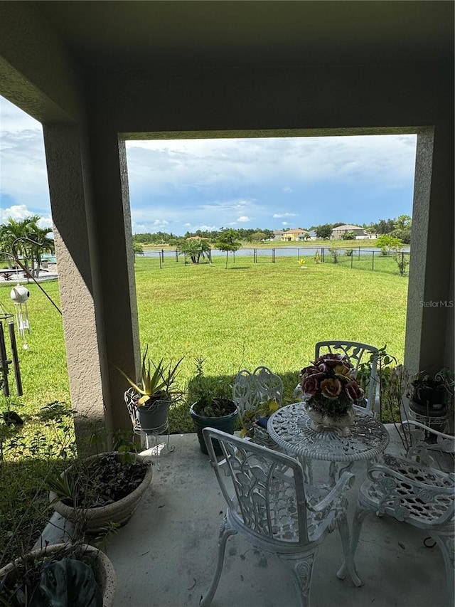 8171 Gopher Tortoise Trl, Lehigh Acres, FL 33974 - view of patio / terrace featuring a water view