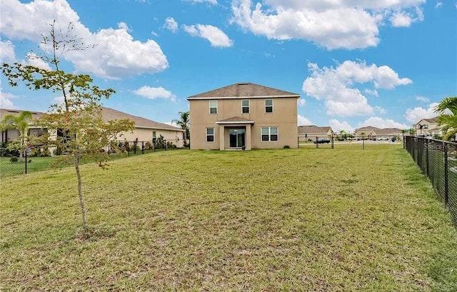 8171 Gopher Tortoise Trl, Lehigh Acres, FL 33974 - rear view of house featuring stucco siding