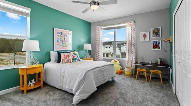 7876 Marlow Pl, Kissimmee, FL 34747 - carpeted bedroom featuring a closet and a ceiling fan