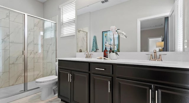 7876 Marlow Pl, Kissimmee, FL 34747 - full bathroom with marble look tiles, a marble finish shower, toilet, double vanity, and crown molding