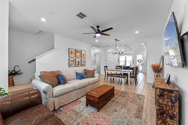 8460 Sperry St, Orlando, FL 32827 - living room with a ceiling fan, recessed lighting, a chandelier, light wood-type flooring, and stairway