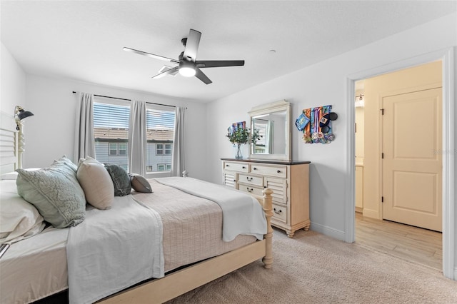 8460 Sperry St, Orlando, FL 32827 - bedroom with light carpet, ceiling fan, and baseboards