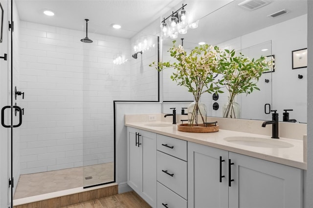 8460 Sperry St, Orlando, FL 32827 - full bath featuring double vanity, a stall shower, wood finished floors, and recessed lighting