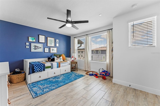 8460 Sperry St, Orlando, FL 32827 - bedroom featuring wood finished floors, baseboards, and ceiling fan