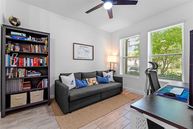 8460 Sperry St, Orlando, FL 32827 - office featuring ceiling fan, light wood-type flooring, and baseboards