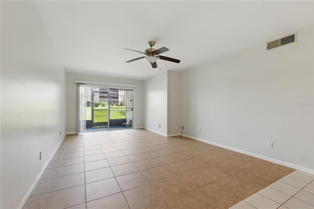 1415 Doolittle Ln Unit 106, Dunedin, FL 34698 - spare room featuring tile patterned flooring, ceiling fan, and baseboards