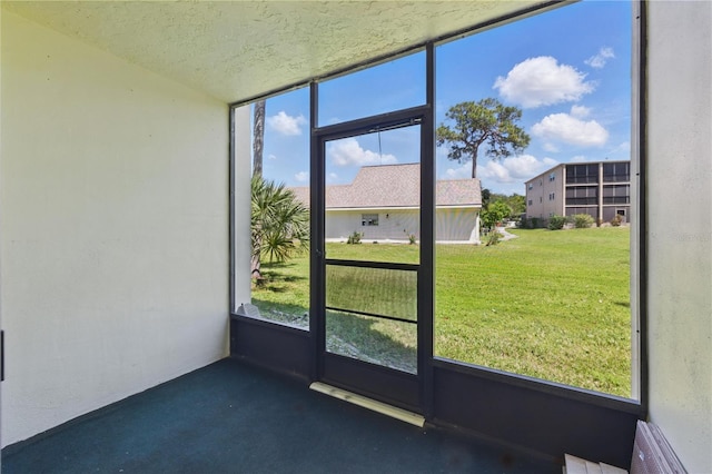 1415 Doolittle Ln Unit 106, Dunedin, FL 34698 - unfurnished sunroom with plenty of natural light
