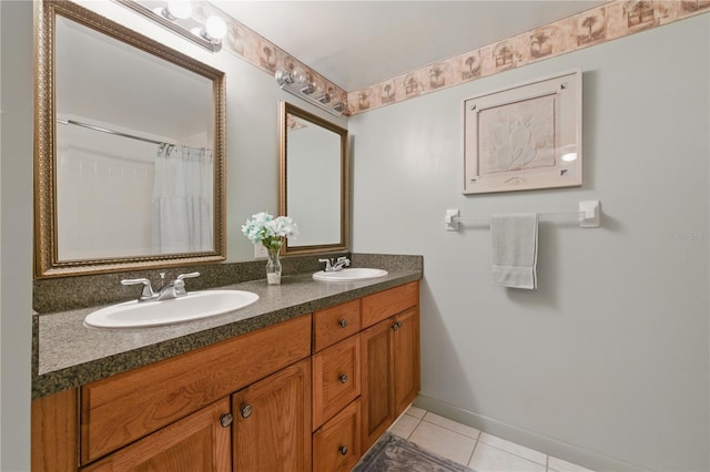 1415 Doolittle Ln Unit 106, Dunedin, FL 34698 - full bath with tile patterned floors, double vanity, and baseboards
