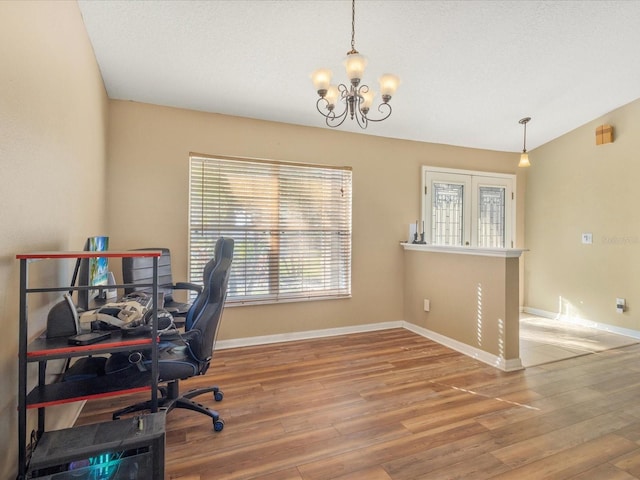 10247 Mason Loop, Clermont, FL 34711 - home office featuring a chandelier, wood finished floors, and baseboards