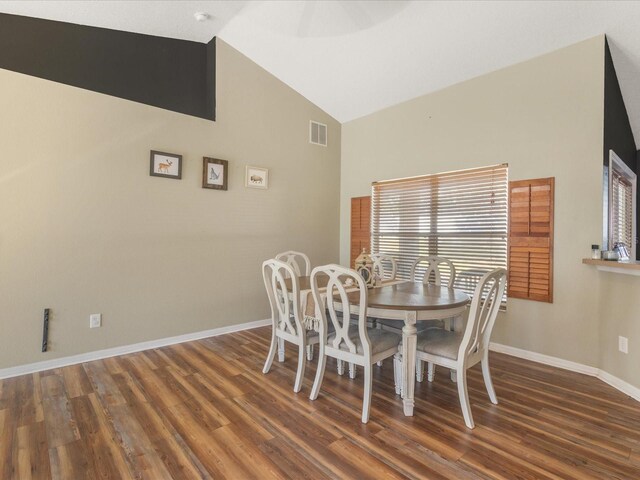 10247 Mason Loop, Clermont, FL 34711 - dining room featuring wood finished floors, baseboards, and high vaulted ceiling