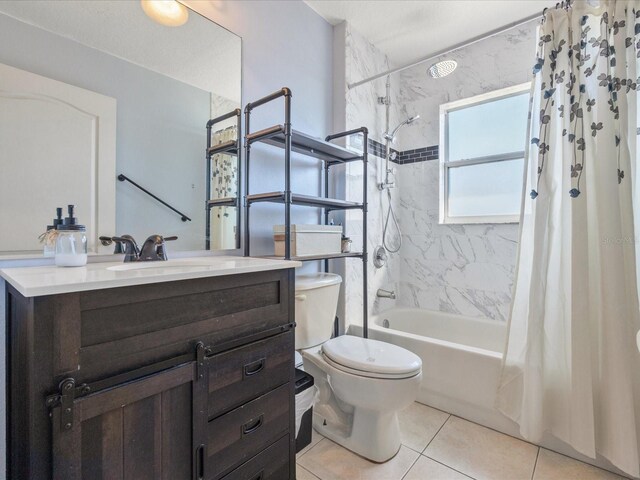 10247 Mason Loop, Clermont, FL 34711 - full bathroom with shower / bath combo, toilet, tile patterned flooring, and vanity