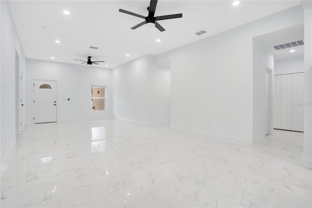spare room with ceiling fan, baseboards, and recessed lighting