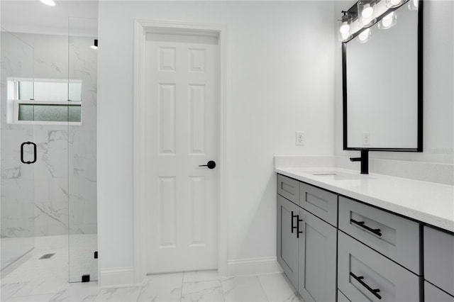 full bath with marble finish floors, baseboards, a marble finish shower, and vanity