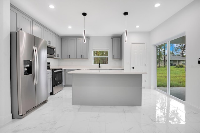 kitchen featuring appliances with stainless steel finishes, gray cabinetry, healthy amount of natural light, light countertops, and recessed lighting