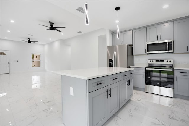 kitchen featuring appliances with stainless steel finishes, gray cabinetry, light marble finish flooring, a ceiling fan, and recessed lighting