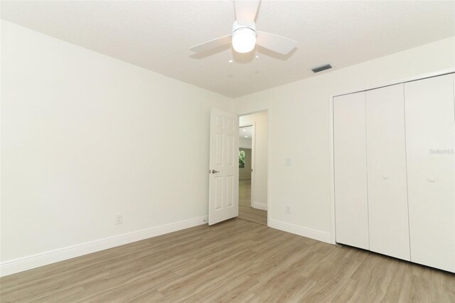 1204 Duncan Ct, Longwood, FL 32779 - unfurnished bedroom featuring light wood-type flooring, baseboards, a closet, and ceiling fan