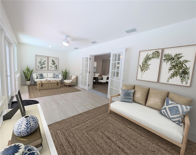 1204 Duncan Ct, Longwood, FL 32779 - living room featuring french doors, a ceiling fan, and wood finished floors