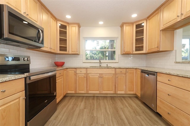 1204 Duncan Ct, Longwood, FL 32779 - kitchen with appliances with stainless steel finishes, light brown cabinetry, plenty of natural light, and recessed lighting