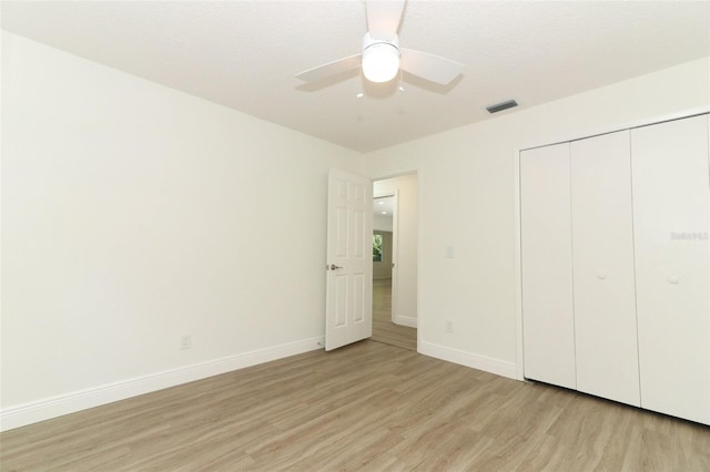 1204 Duncan Ct, Longwood, FL 32779 - unfurnished bedroom with light wood finished floors, a closet, and a ceiling fan