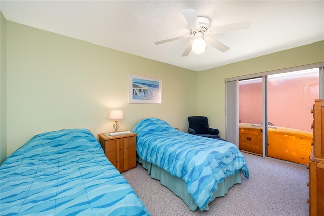 bedroom with light colored carpet and ceiling fan