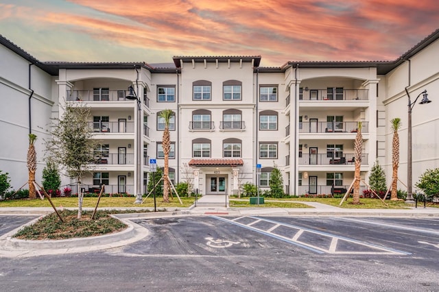 4013 Breakview Dr Unit A407, Orlando, FL 32819 - property at dusk with uncovered parking