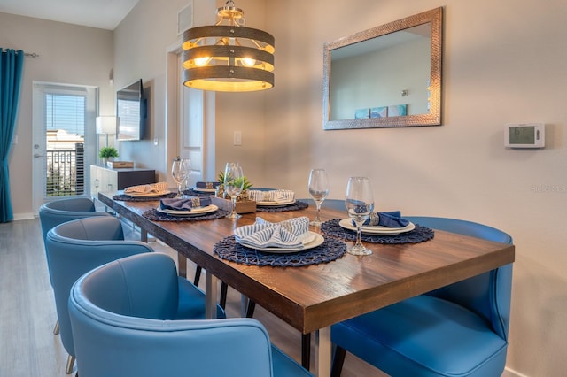 4013 Breakview Dr Unit A407, Orlando, FL 32819 - dining area with wood finished floors and baseboards