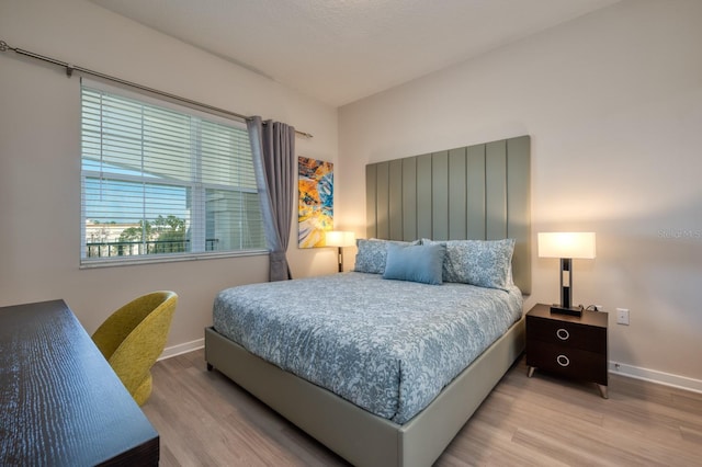 4013 Breakview Dr Unit A407, Orlando, FL 32819 - bedroom with wood finished floors and baseboards