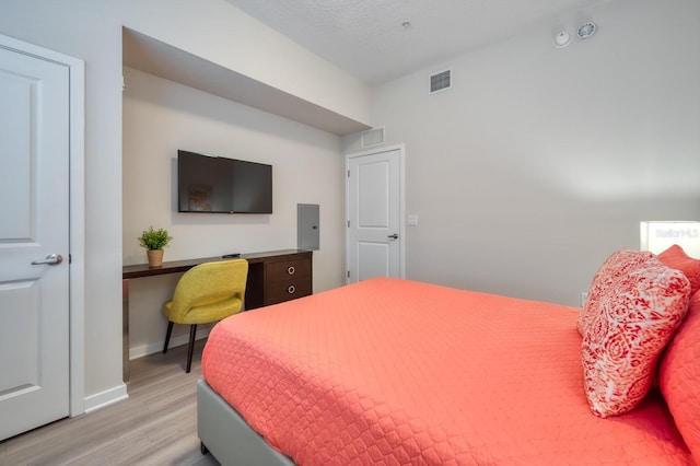4013 Breakview Dr Unit A407, Orlando, FL 32819 - bedroom with wood finished floors, baseboards, and a desk