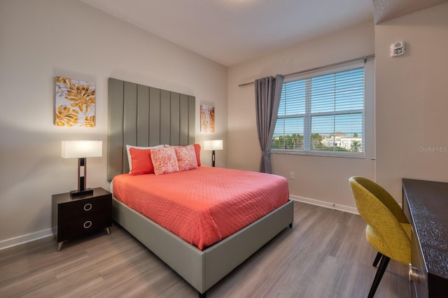 4013 Breakview Dr Unit A407, Orlando, FL 32819 - bedroom featuring wood finished floors and baseboards