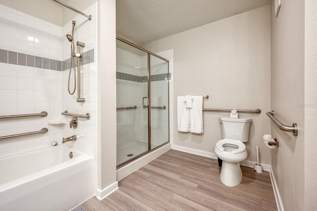 4013 Breakview Dr Unit A407, Orlando, FL 32819 - full bath with toilet, wood finished floors, baseboards, and a textured ceiling